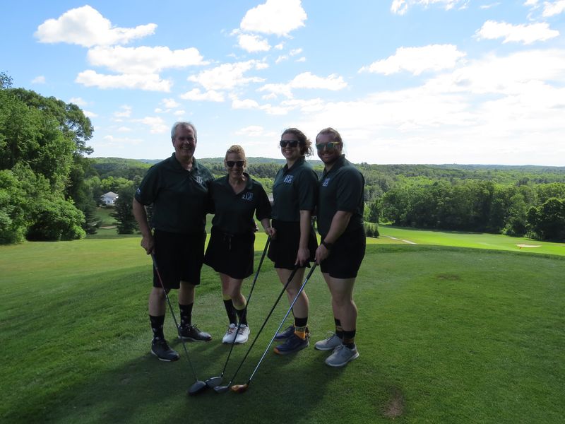 Foursome with the valley behind them