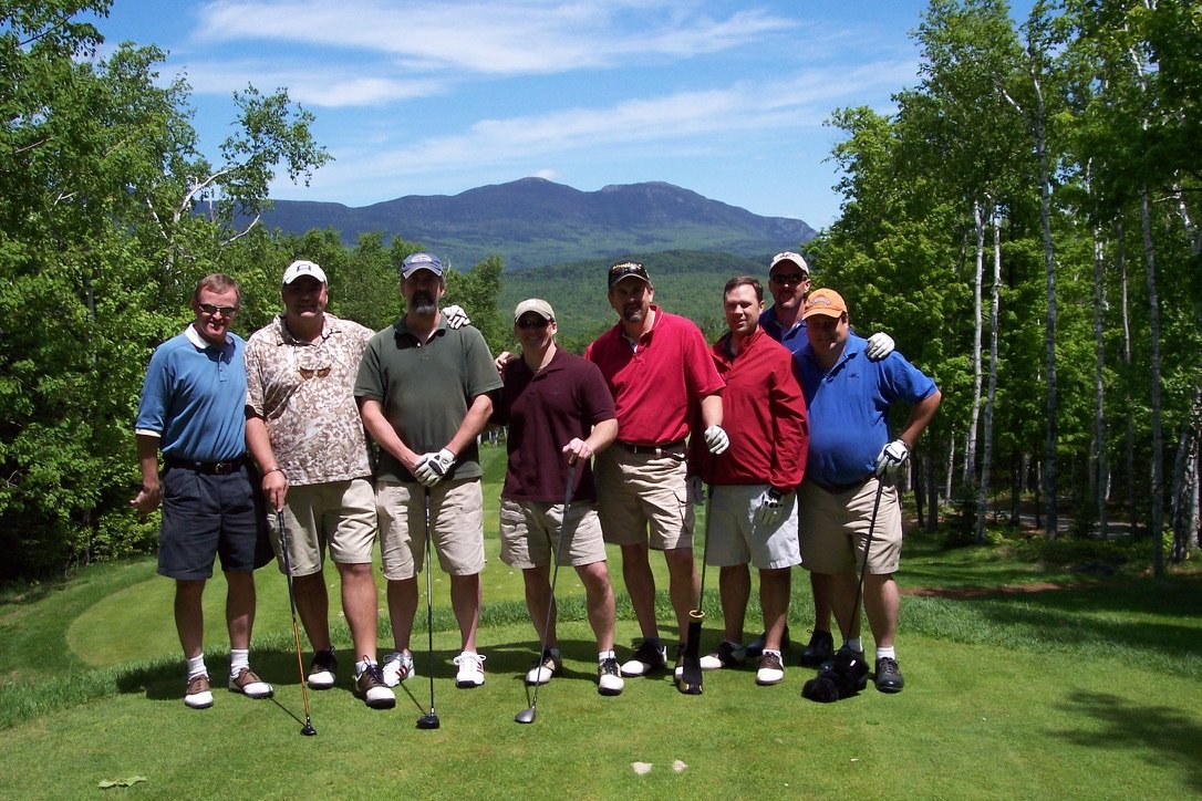 Chris Redman, fifth from left in the red shirt and baseball hat, with friends on the first tee at Sugarloaf